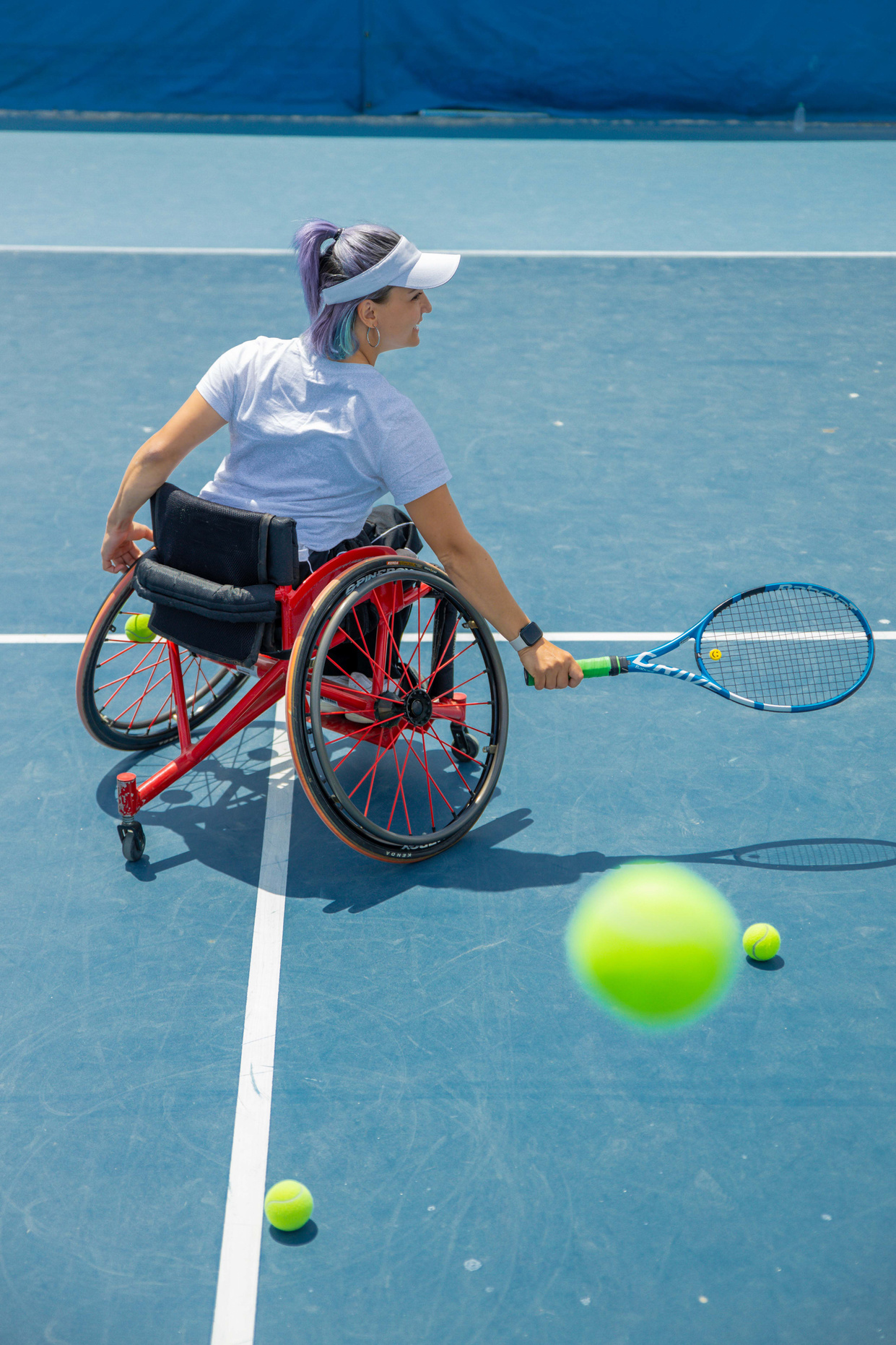 Young Woman on a Wheelchair Playing Tennis